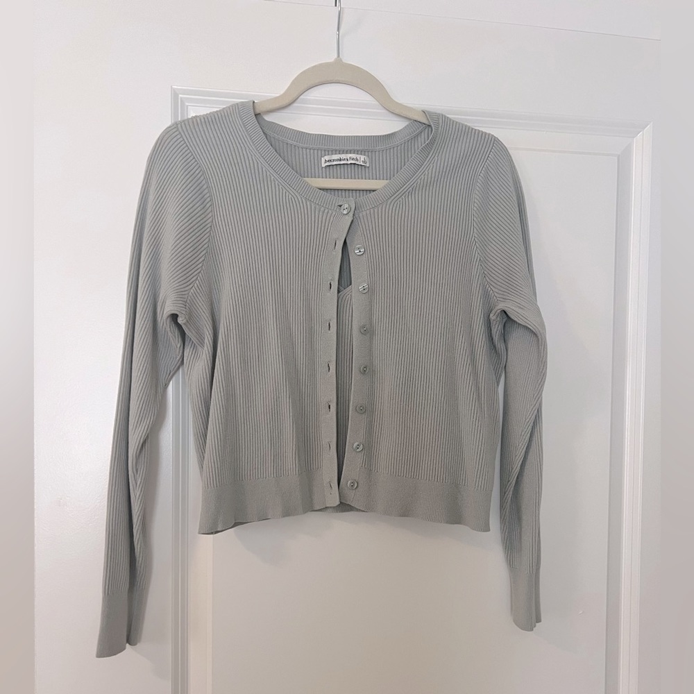 Cardigan and tank top sweater set.
